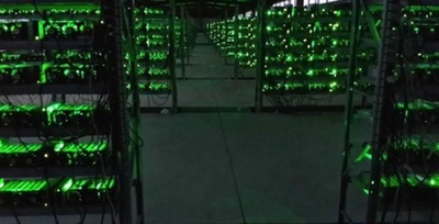 A large-scale mining farm with rows of mining rigs, showcasing the infrastructure of a hosted mining facility